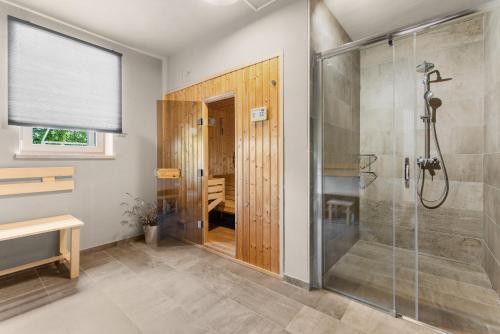 a bathroom with a shower and a glass shower stall at Stoje in Svetvinčenat