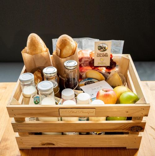 a wooden crate filled with food and other food items at Vila Jana in Radovljica