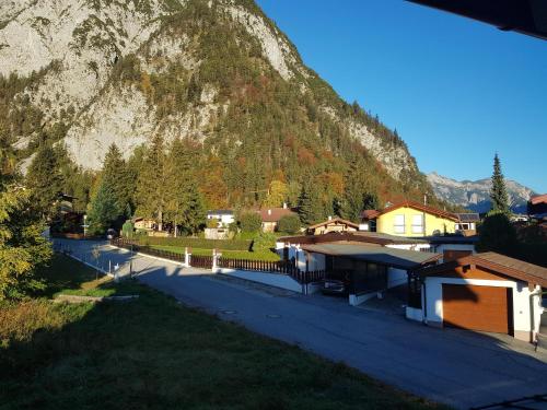 a small village with a mountain in the background at Mountain Pearl in Maurach