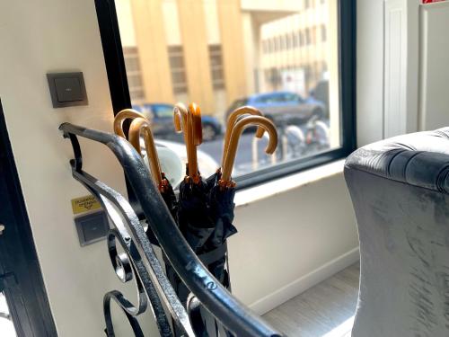 an umbrella in a holder next to a window at Villa Berlioz in Nice