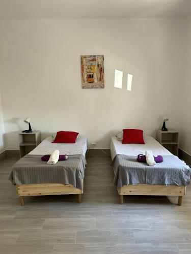 two beds sitting next to each other in a room at Oriente DNA Studios IV in Lisbon