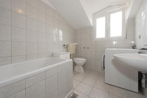 Koupelna v ubytování Apartments Remini