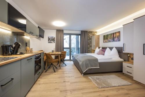 Η κουζίνα ή μικρή κουζίνα στο Weitenmoos Panorama Apartments
