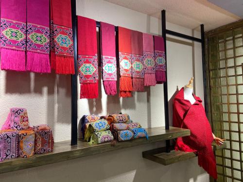 a room with a shelf with colorful mats and boxes at Zhangjiajie National Park Nvue Resorts in Zhangjiajie