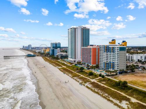 an aerial view of the beach and buildings at Ocean Front 2BR Elegant Condo in Atlantica Resort in Myrtle Beach