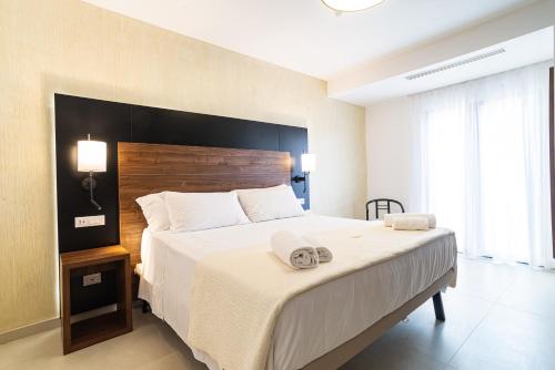Katil atau katil-katil dalam bilik di Hotel La Principessa