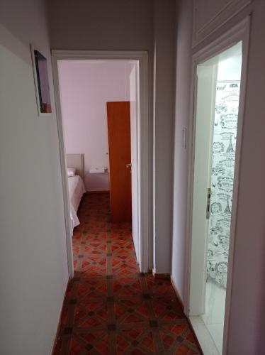 an empty hallway with a door and a room with a floor at Giorgos house in Nea Kalikratia