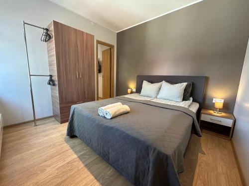 Postel nebo postele na pokoji v ubytování Jon´s 2 Apartments