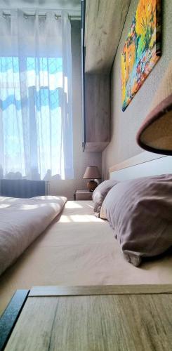 a bedroom with two beds and a window at Old Town #Menorah #MostCity in Dnipro