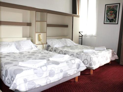 Katil atau katil-katil dalam bilik di Hotel Du Gave