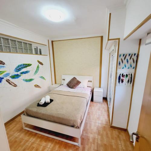 A bed or beds in a room at Grandera Apart`s - Pintor 31