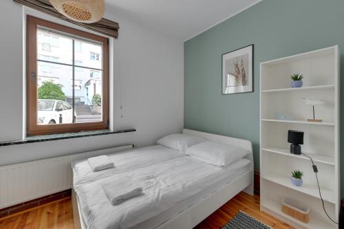 Posteľ alebo postele v izbe v ubytovaní Grand Apartments - Balticana Apartment