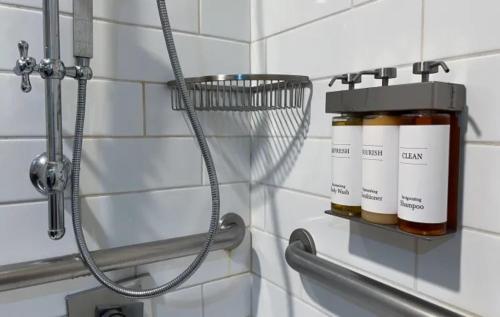 a bottle of honey on a rack in a bathroom at Empeiria High Sierra Hotel in Mammoth Lakes