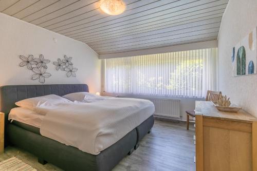 Postel nebo postele na pokoji v ubytování "Nordseetraum" Nordseetraum, Bungalow