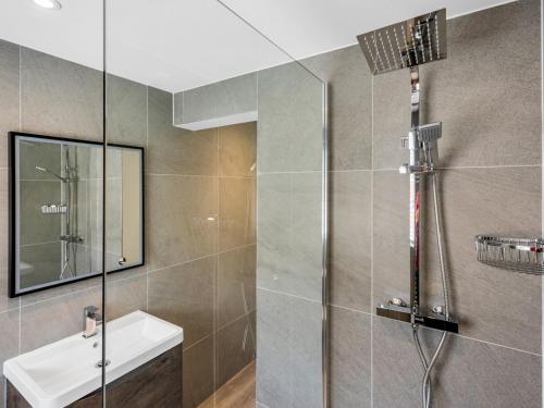 a bathroom with a shower and a sink at Pass the Keys Flat 1 Elegance Meets Modern Luxury in Whitstable