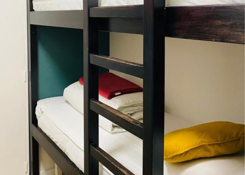 a bunk bed room with four bunk beds in it at FLOR de MONTANHAS - 4PERS - Appart vacances in Arette