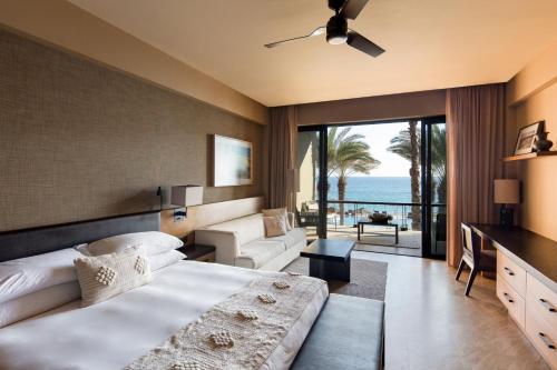 a bedroom with a bed and a view of the ocean at Casa Maat at JW Marriott Los Cabos Beach Resort & Spa in San José del Cabo