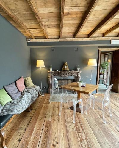 a living room with a couch and a table at Locanda Maison Verte in Cantalupa