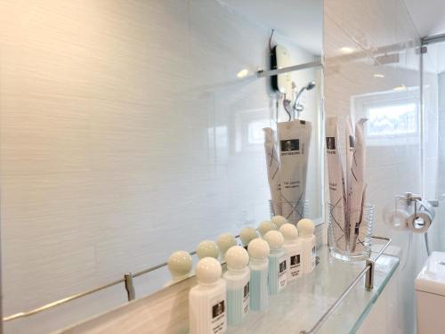 a glass counter with a bunch of objects on it at White Horse Dalat Hotel in Da Lat