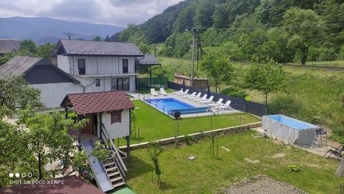 an aerial view of a house with a swimming pool at Gorec in Yaremche