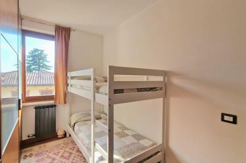 Giường trong phòng chung tại Casa le due terrazze - Pool