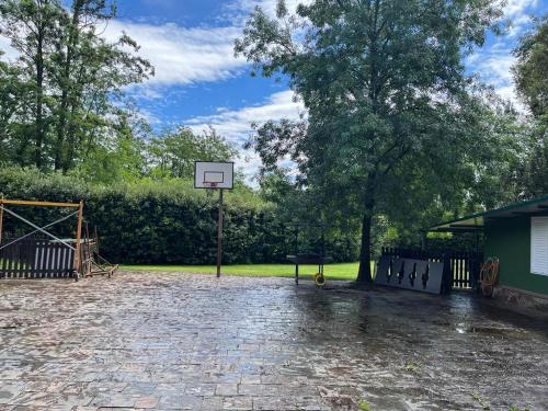 a basketball hoop on a brick driveway in a park at casa rústica in Olot