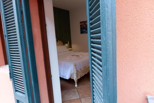 a view of a bedroom with a bed through a door at Residenza Catullo in Verona
