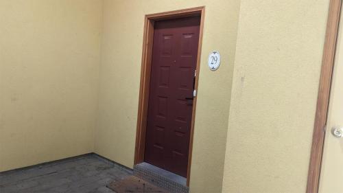an empty room with a brown door in the corner at Crystal Forest #29 by Bear Country in Sun Peaks