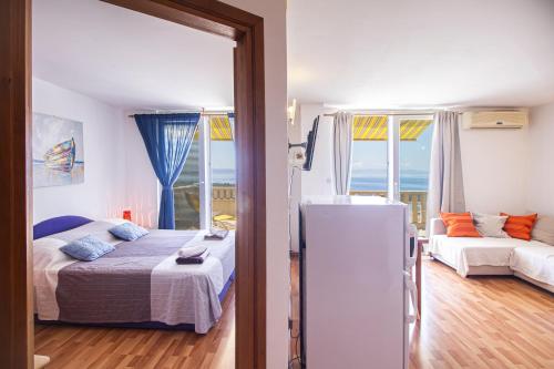 Postel nebo postele na pokoji v ubytování Apartments Branka