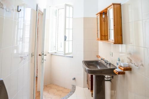 a bathroom with a sink and a shower at Casa a Modolo - Francesca in Modolo