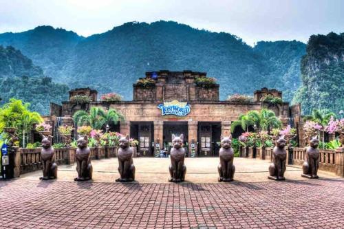 a building with a group of statues in front of it at Stylish Cozy House Near Ipoh Lost World Tambun in Kampong Batu Lapan