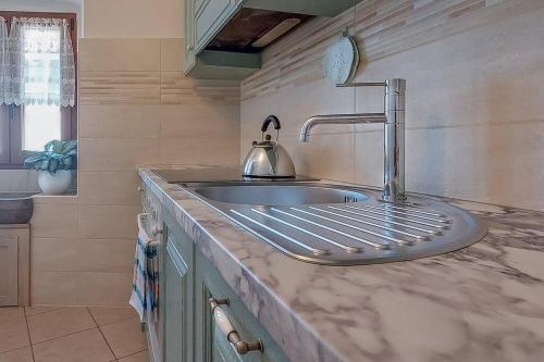 A kitchen or kitchenette at Sea View Karst House Apartment with Bikes