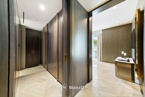 a hallway with a bathroom with a sink at Manzil - Lavish 2BR Sea View Apartment in Five Palm, Palm Jumeirah in Dubai