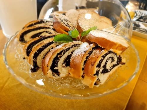 a glass bowl with a dessert on a table at Apartmány Malý Princ in Bojnice