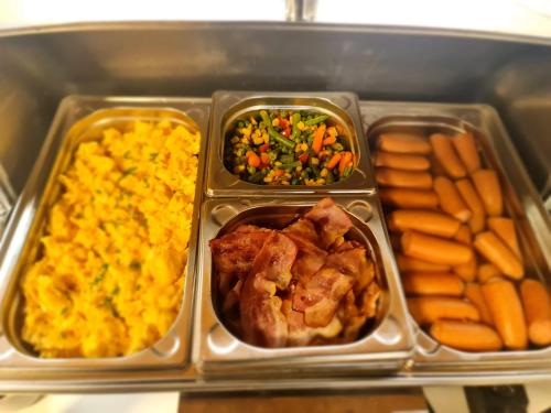 a tray of food with different types of food at Apartmány Malý Princ in Bojnice