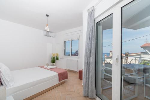 Katil atau katil-katil dalam bilik di Anesis Seaview Apartment