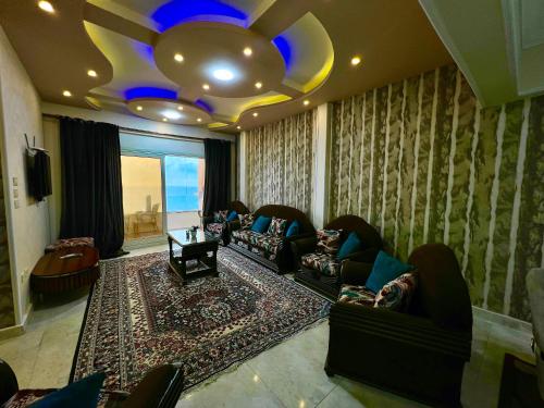 a large living room with couches and a ceiling at سى فيو السريا in Alexandria