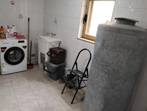 a laundry room with a washing machine and a washer at HOUSE MIRIAM in Reggio Calabria