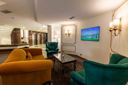 TV/Unterhaltungsangebot in der Unterkunft Marble Hotel