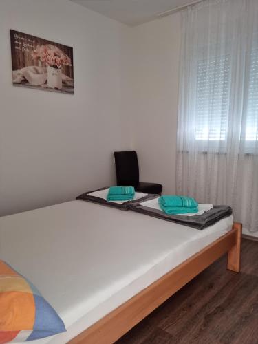 Ένα ή περισσότερα κρεβάτια σε δωμάτιο στο Appartments D&D