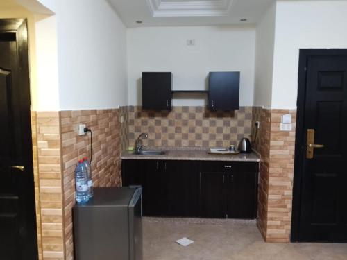 a kitchen with a sink and a counter top at Dead sea 2 bedroom apartment in Astana ,swemeh Jordan in Sowayma
