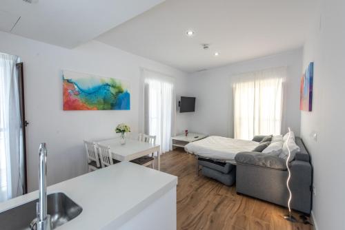 Postel nebo postele na pokoji v ubytování Apartamentos Santa María 15