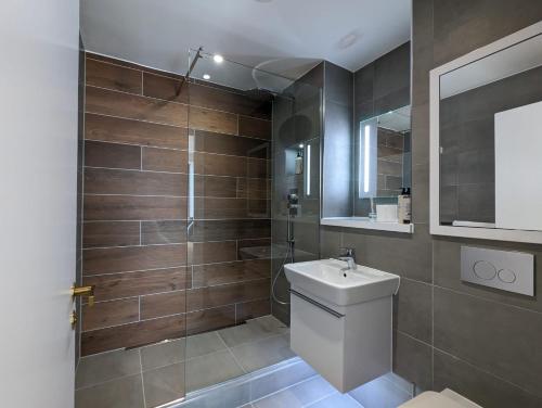 a bathroom with a toilet and a sink and a shower at Manchester Townhouses by Charles Hope in Manchester