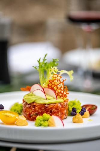 a plate of food with fruit and vegetables on it at Prümer Gang Restaurant & Hotel in Bad Neuenahr-Ahrweiler