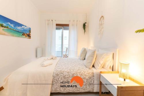 Postel nebo postele na pokoji v ubytování #083 Balcony with AC, Garden View 5min Beach