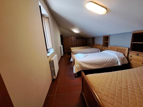 Letto o letti in una camera di Casa per Ferie Ulivo d'Assisi