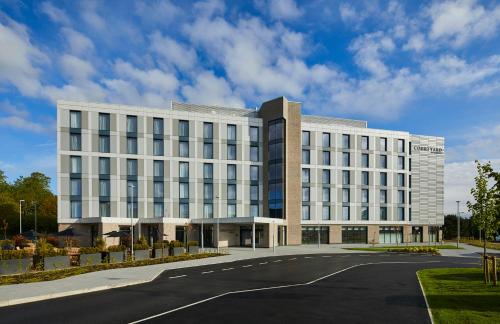 a large white building with a road in front of it at Courtyard by Marriott Stoke on Trent Staffordshire in Stoke on Trent