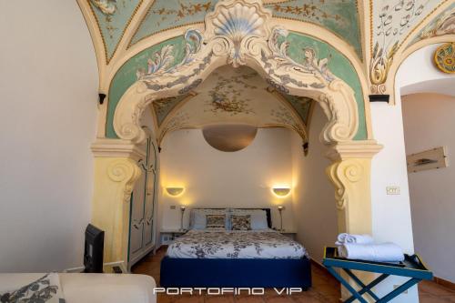 a bedroom with a bed with a ceiling at Casa Papù 2 by PortofinoVip in Portofino