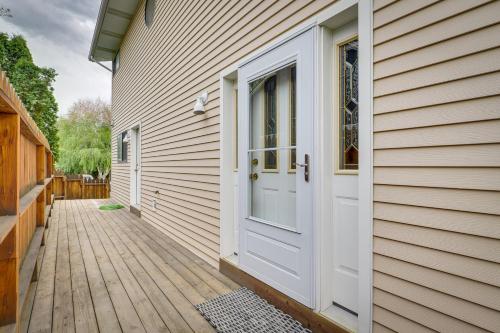 a house with a white door and a wooden walkway at Charming Elko Home with Pool Table! in Elko