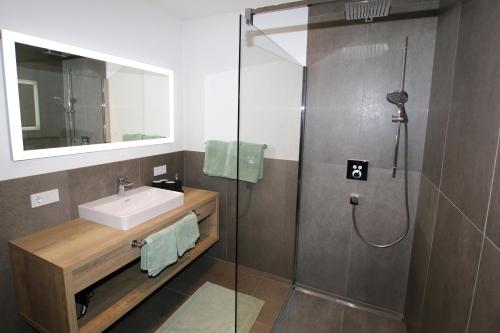 a bathroom with a sink and a shower at Apart Christoph in Oetz